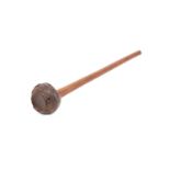 A WOOD KNOBKERRIE With a long narrow handle terminated in a bulbous finial, flattened on the