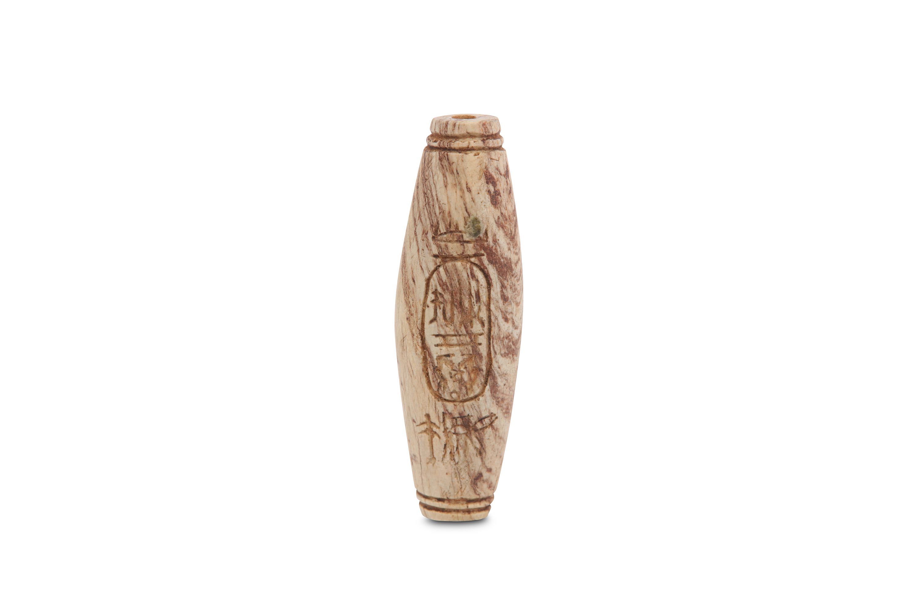 AN EGYPTIAN INSCRIBED FAIENCE BEAD Third Intermedi