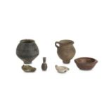 A GROUP OF ANCIENT POTTERY VESSELS Including a bla