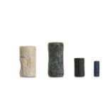 FOUR MESOPOTAMIAN CYLINDER SEALS Circa 3rd - 2nd M