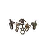 A GROUP OF DOGON RINGS, MALI Each ring composed of a thick band surmounted by various figural