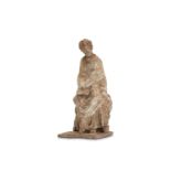 A TANAGRA TERRACOTTA FEMALE FIGURE  Circa 3rd Cent