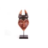 A WESTERN PENDE WOOD MASK A finely made mask with a heart shaped face, slit eyes, an oblong nose and