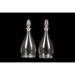 A PAIR OF GLASS MAGNUM DECANTERS AND STOPPERS