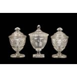 THREE REGENCY CUT GLASS TABLE URNS OR SWEETMEAT JARS AND COVERS