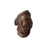 A carved giltwood head of a gentleman, late 17th or 18th Century, wearing a plumed hat and looking