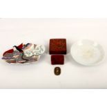 A collection of Japanese and Asian items, including a small Meiji period red lacquered box and cover