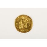 A Byzantine Gold Solidus of Phocas (602-610AD), Constantinople, obv. Phocas facing bust, bearded,