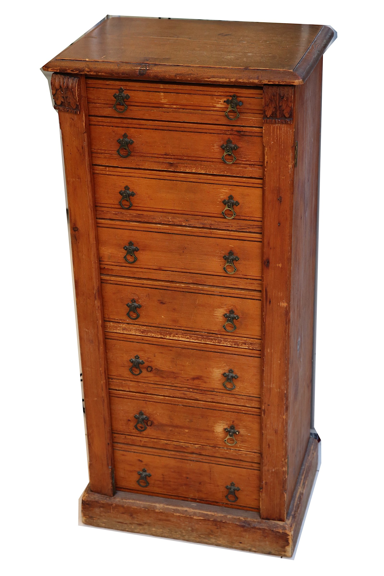 A late Victorian pine wellington chest, fitted with eight graduated drawers with twin locking