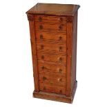 A late Victorian pine wellington chest, fitted with eight graduated drawers with twin locking