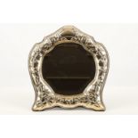 A continental sterling silver dressing table glass with belelled mirror, mid-20th Century,