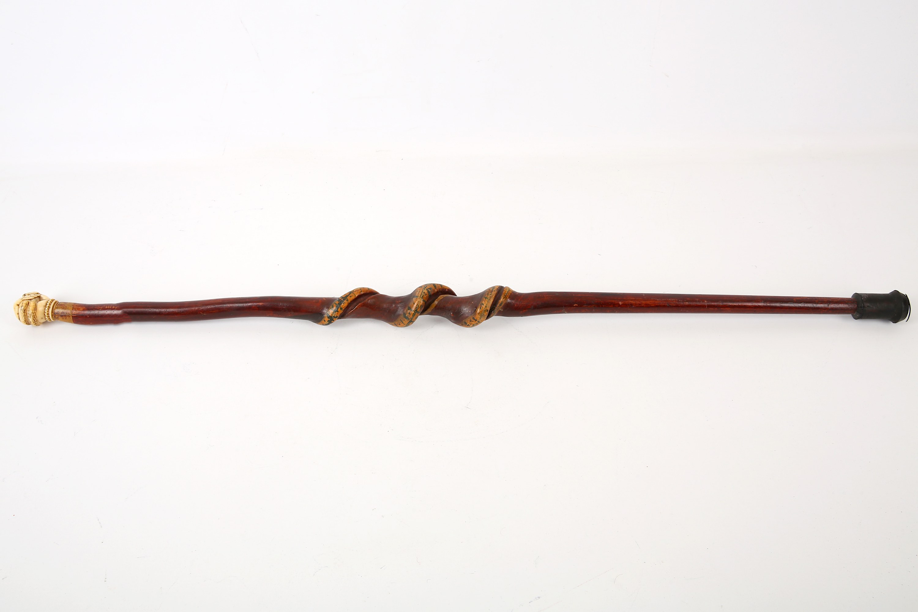 A Victorian marine ivory mounted cane, 19th Century, the knop carved as a clenched fist grasping a