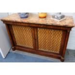 A George IV burr wood side cabinet, the variegated marble top over two brass grill doors flanked