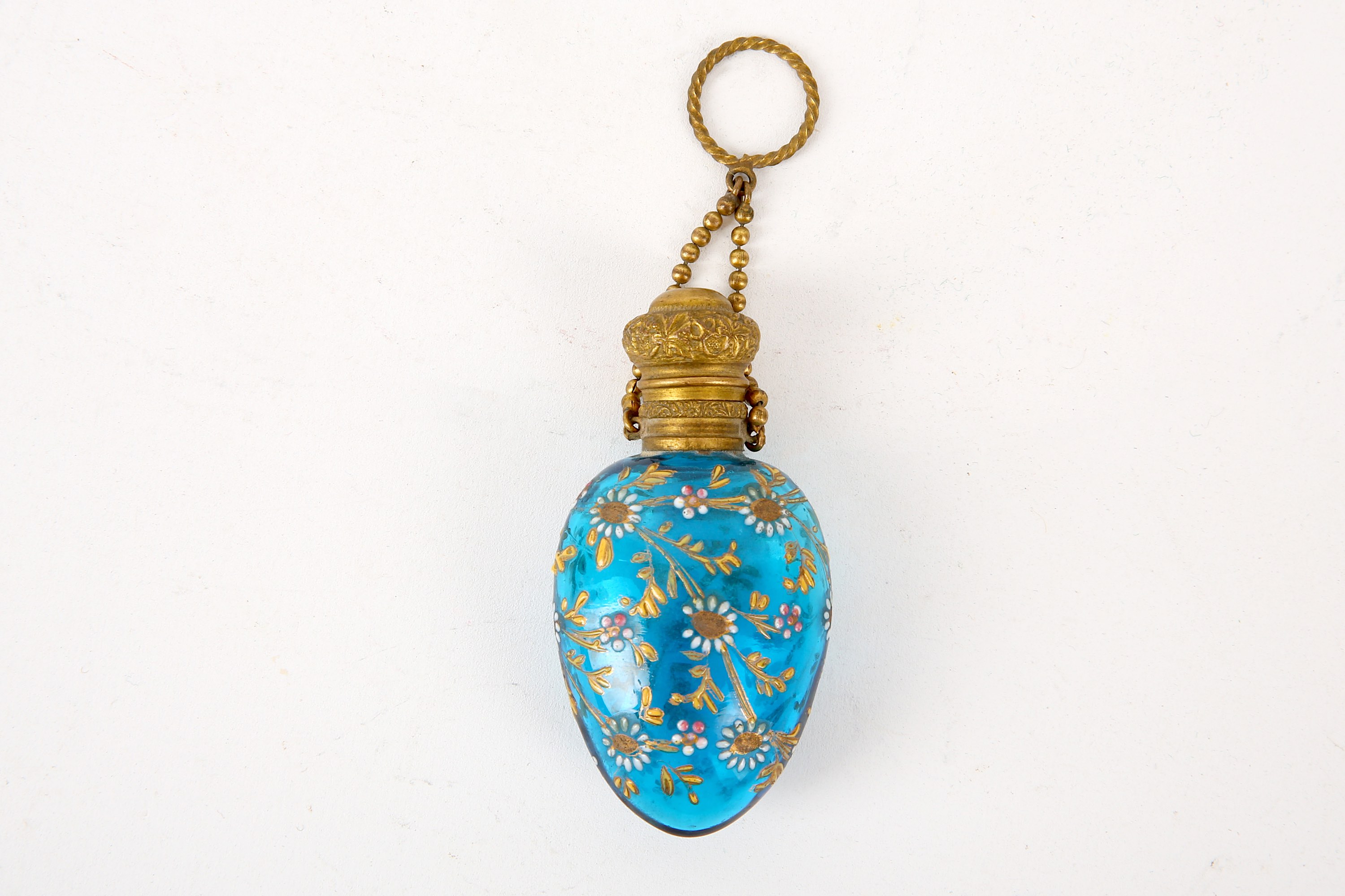 A ladies miniature glass perfume flask, late 19th / early 20th Century, of lozenge form, in blue