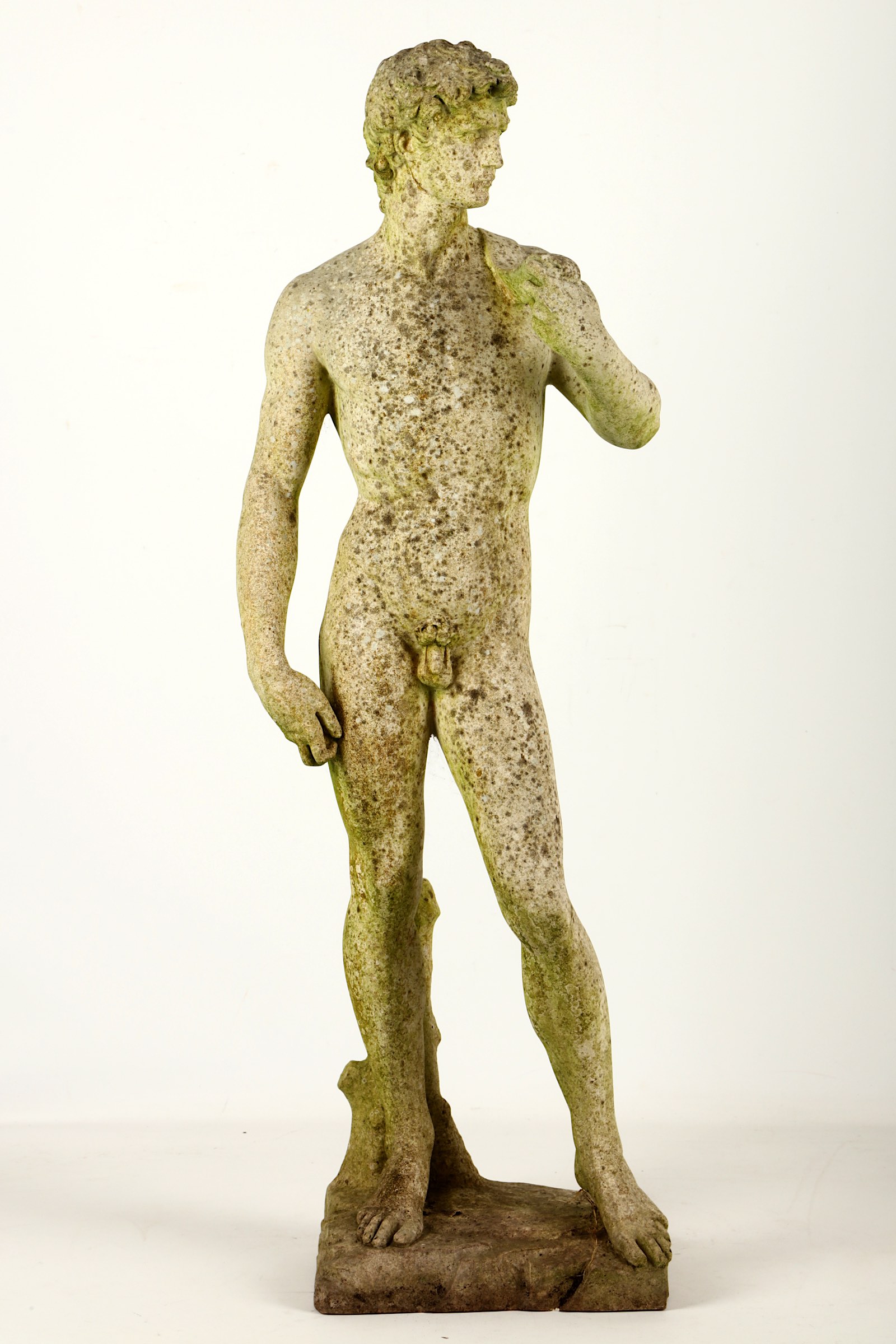 A stone garden figure of David after Michelangelo, late 19th / early 20th Century, in standing