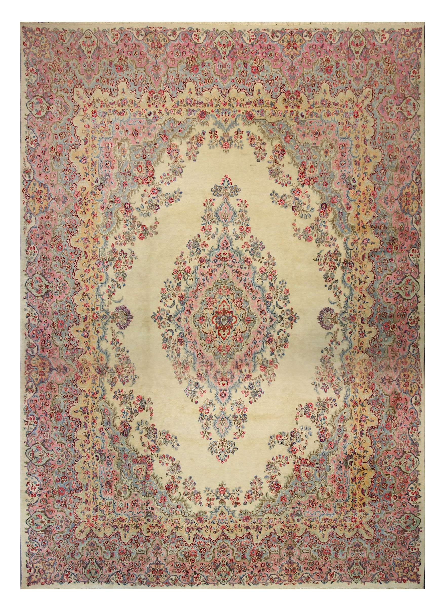 A fine Kirman carpet, South Persia, the light beige field with open floral medallion, the