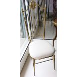 A pair of 1950's Italian chairs, in gilt metal with white fabric upholstery, 116cm high x 42cm