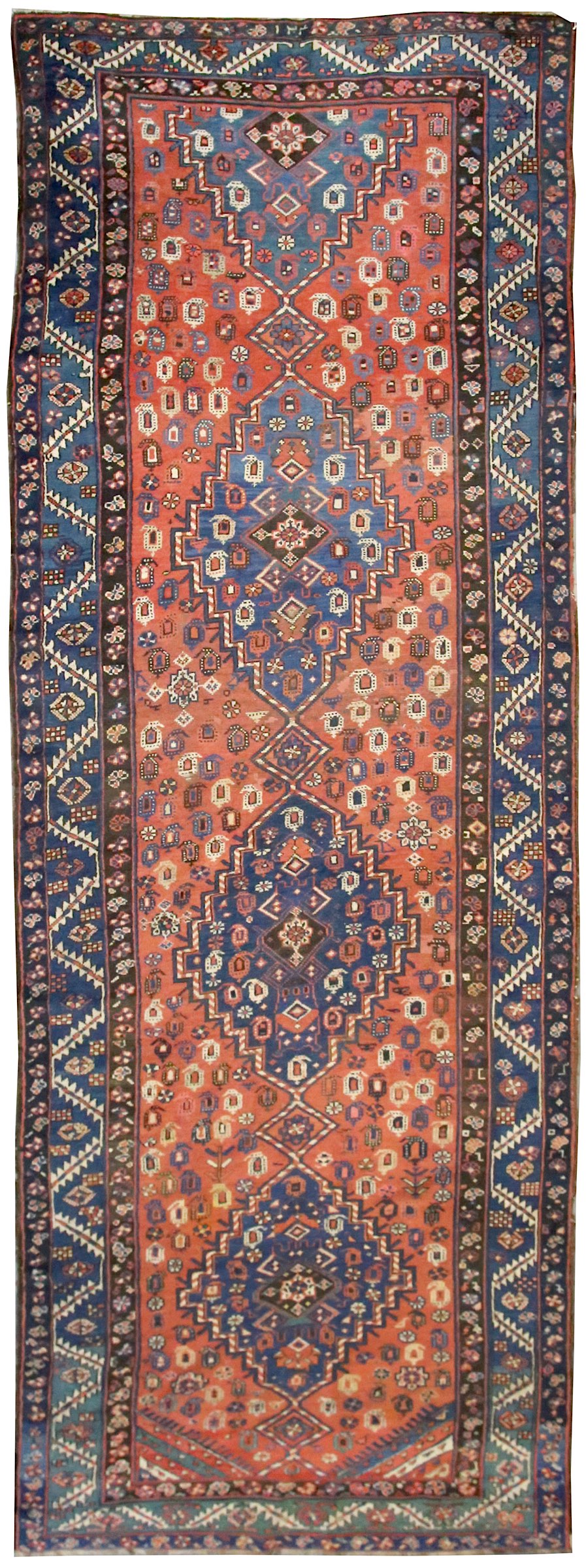 An antique Hamseh rug, Southwest Persia, the field with overall design of hooked and serrated