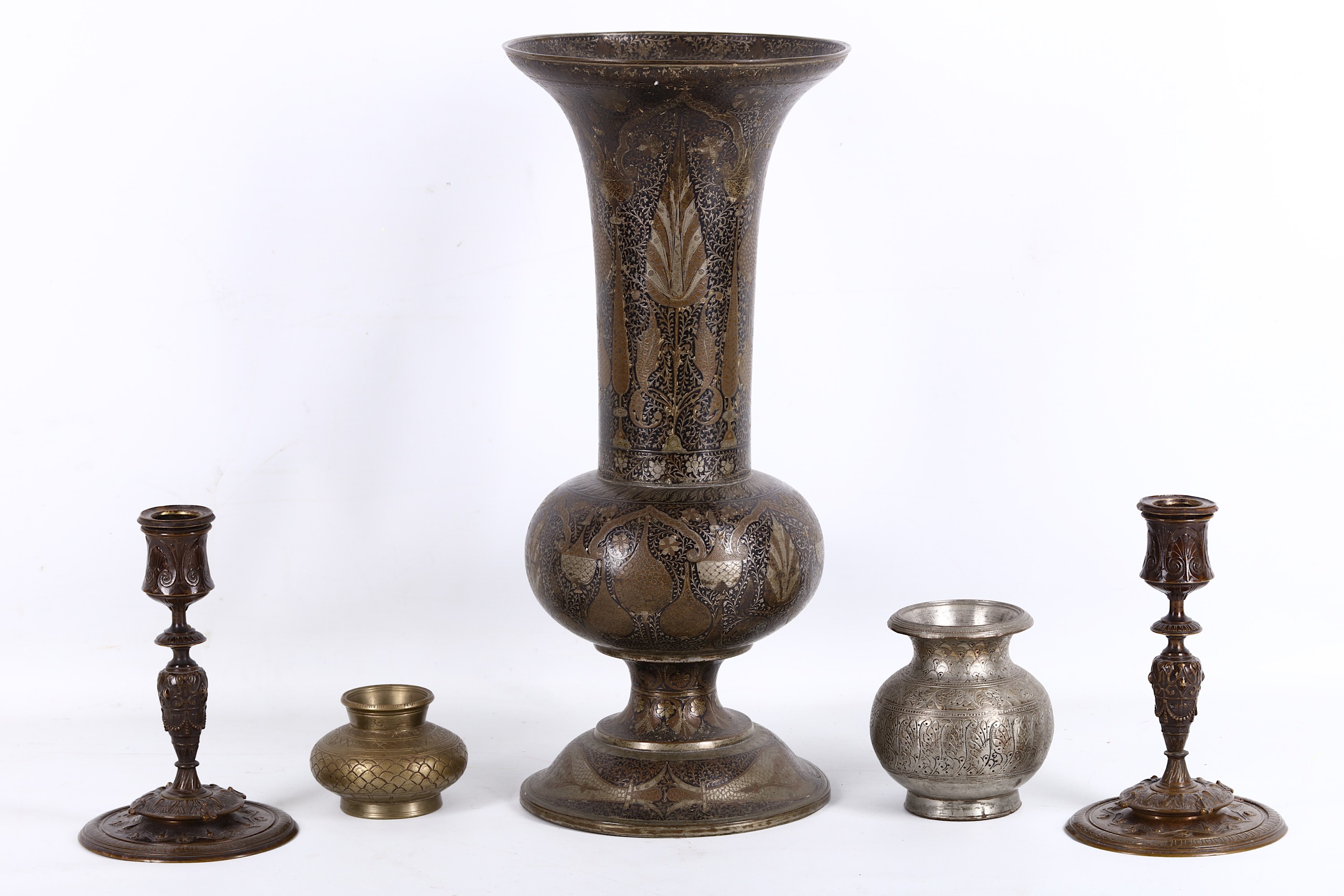 A Persian style silver plated vase, early 20th Century, decorated with Arabesque motifs; together