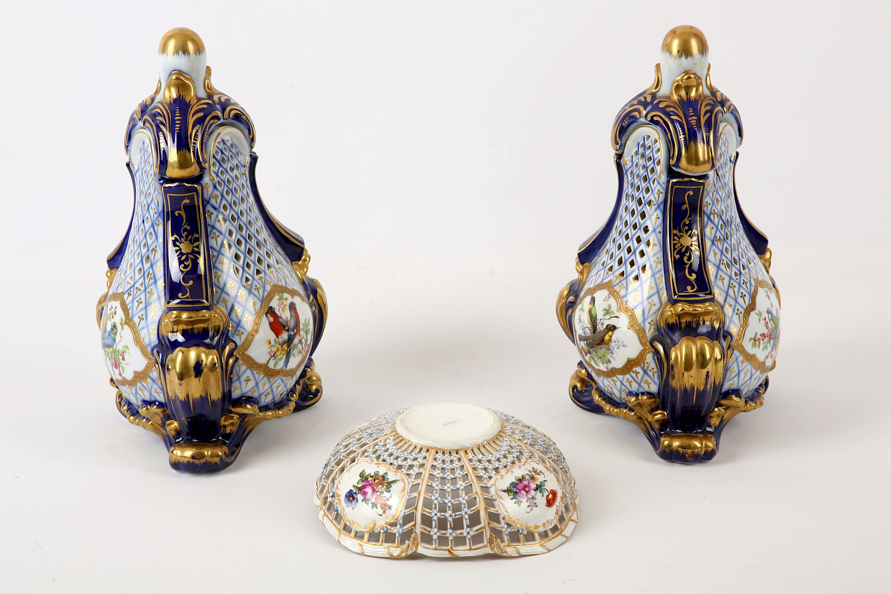 A pair of Continental porcelain reticulated vases and covers, both of three-sided tapered form, - Image 2 of 2