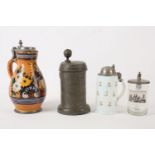 A French glazed earthenware and pewter mounted flagon, 19th Century, of baluster form, decorated