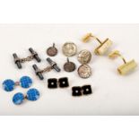 A small collection of jewellery, including a pair of silver and enamel cufflinks by Deakin &