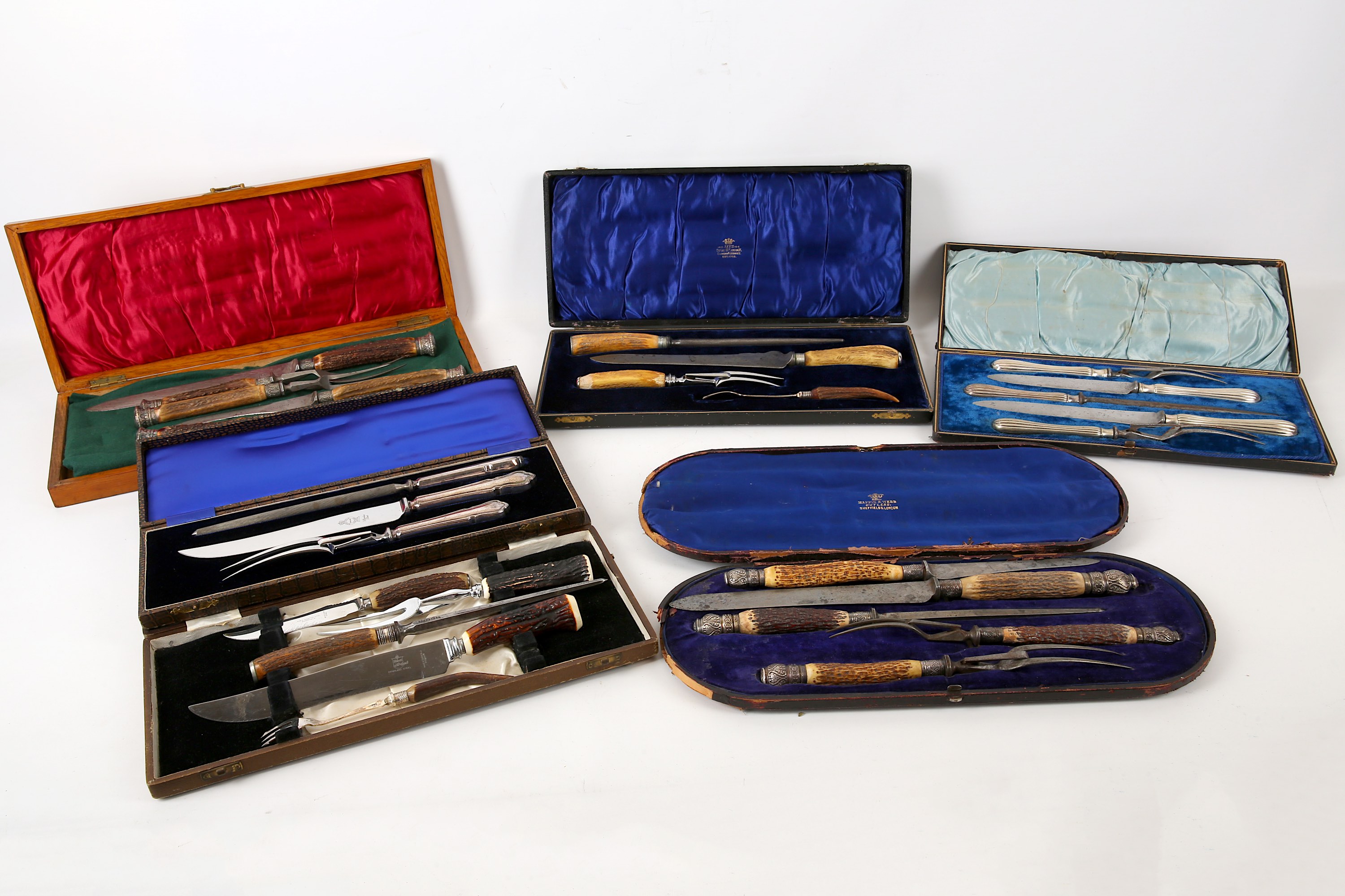 Six Victorian and later cased carving sets, 19th Century, three with stag antler handles, one silver