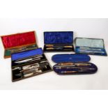 Six Victorian and later cased carving sets, 19th Century, three with stag antler handles, one silver