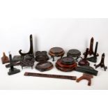 A collection of Chinese carved hardwood vase and other stands, together with assorted plate