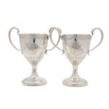 A pair of George III Irish antique sterling silver two-handled cups, Dublin 1806, possibly by Daniel