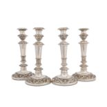A set of four George IV - William IV Old Sheffield silver plate candlesticks circa 1820 - 40