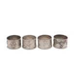 A mixed group of early 20th century Chinese silver napkin rings, including three stamped sterling, b