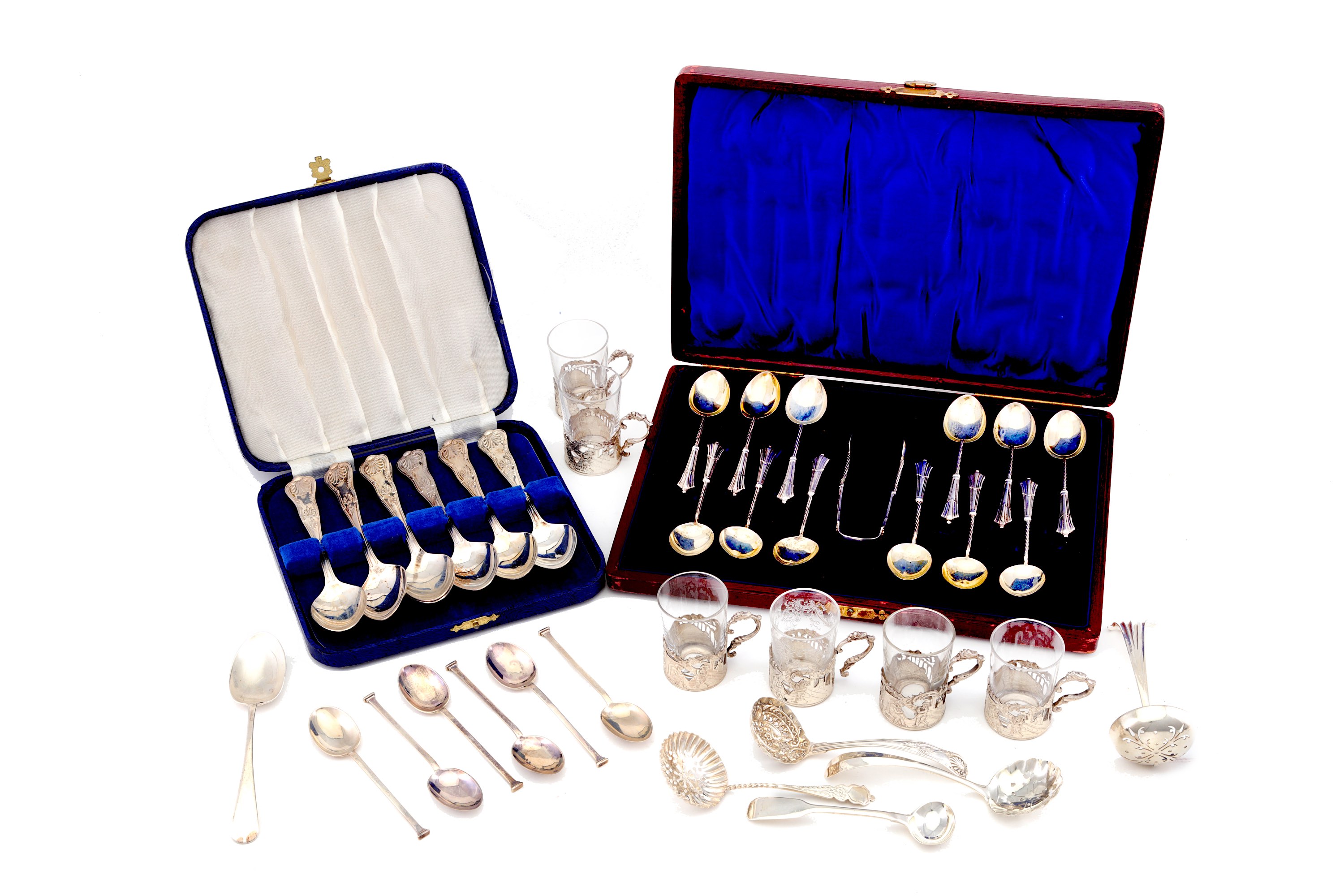 A mixed group of sterling silver items, including a cased set of twelve tea spoons and sugar tongs B