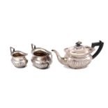 A George V sterling silver bachelors three piece tea service, Birmingham 1919 by H V Pithey & Co