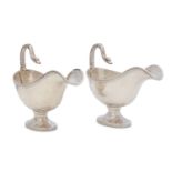 A pair of early 20th century Empire style 950 standard silver sauceboats, Paris 1903-13 by Auguste G