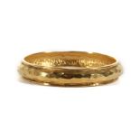 Chanel Hammered Bangle, 1980s, gold tone, 6.5cm diameter Condition Grade B Please refer to