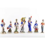 A collection of seven porcelain figures of Napoleonic soldiers, late 19th / 20th Century, each