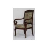 A pair of French Empire mahogany open armchairs, gilt metal mounted with carved top rails, on