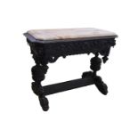 A late 19th Century carved and stained wood Renaissance revival centre table, with a frieze