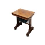 A William IV rosewood work table, fitted with two side drawers over a pull out silks box, on solid
