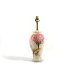 A contemporary Moorcroft Pottery table lamp in the Magnolia pattern, underglaze floral painted and