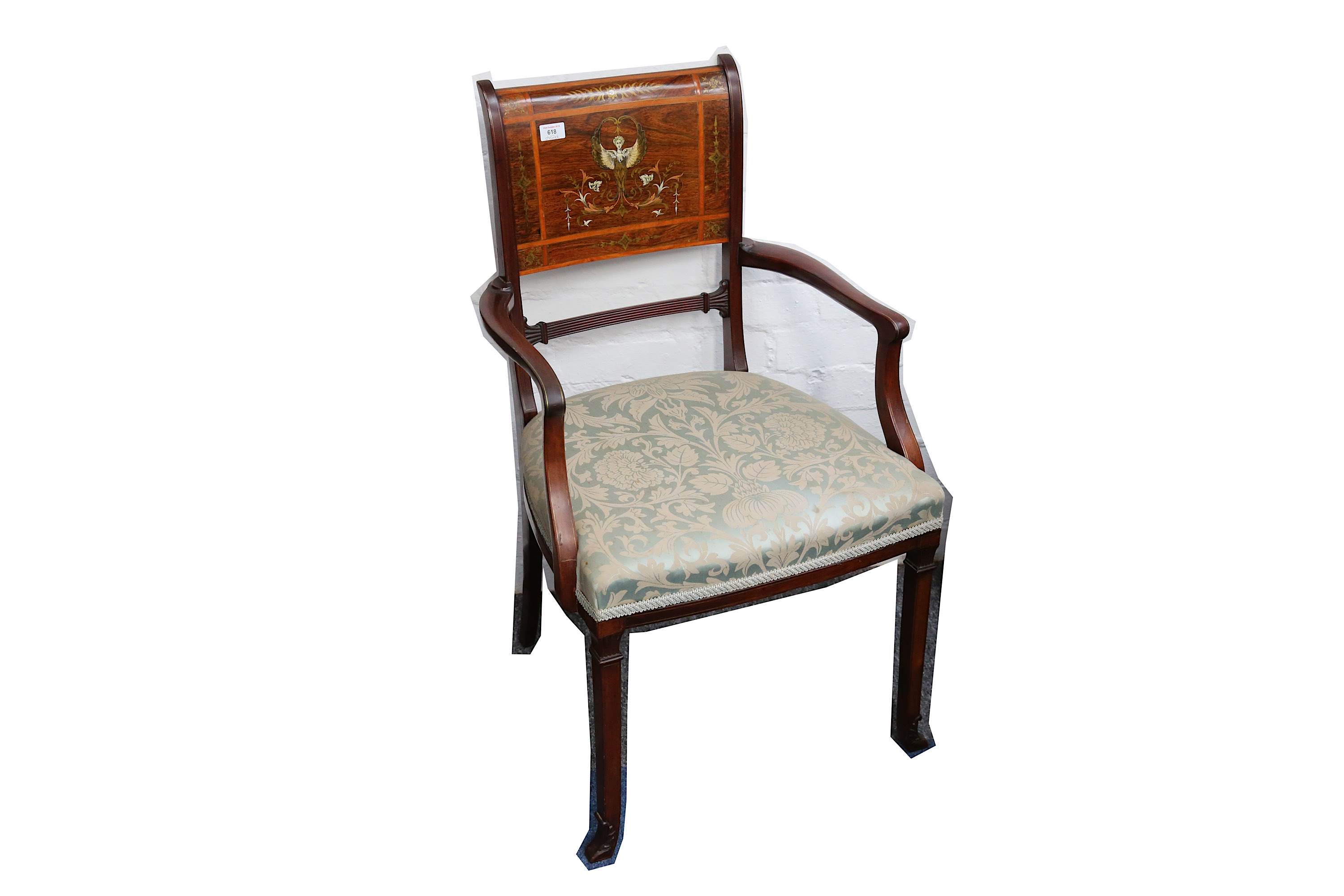 An Edwardian rosewood and mahogany elbow chair in the manner of Edwards and Roberts, the panel
