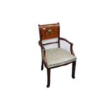 An Edwardian rosewood and mahogany elbow chair in the manner of Edwards and Roberts, the panel