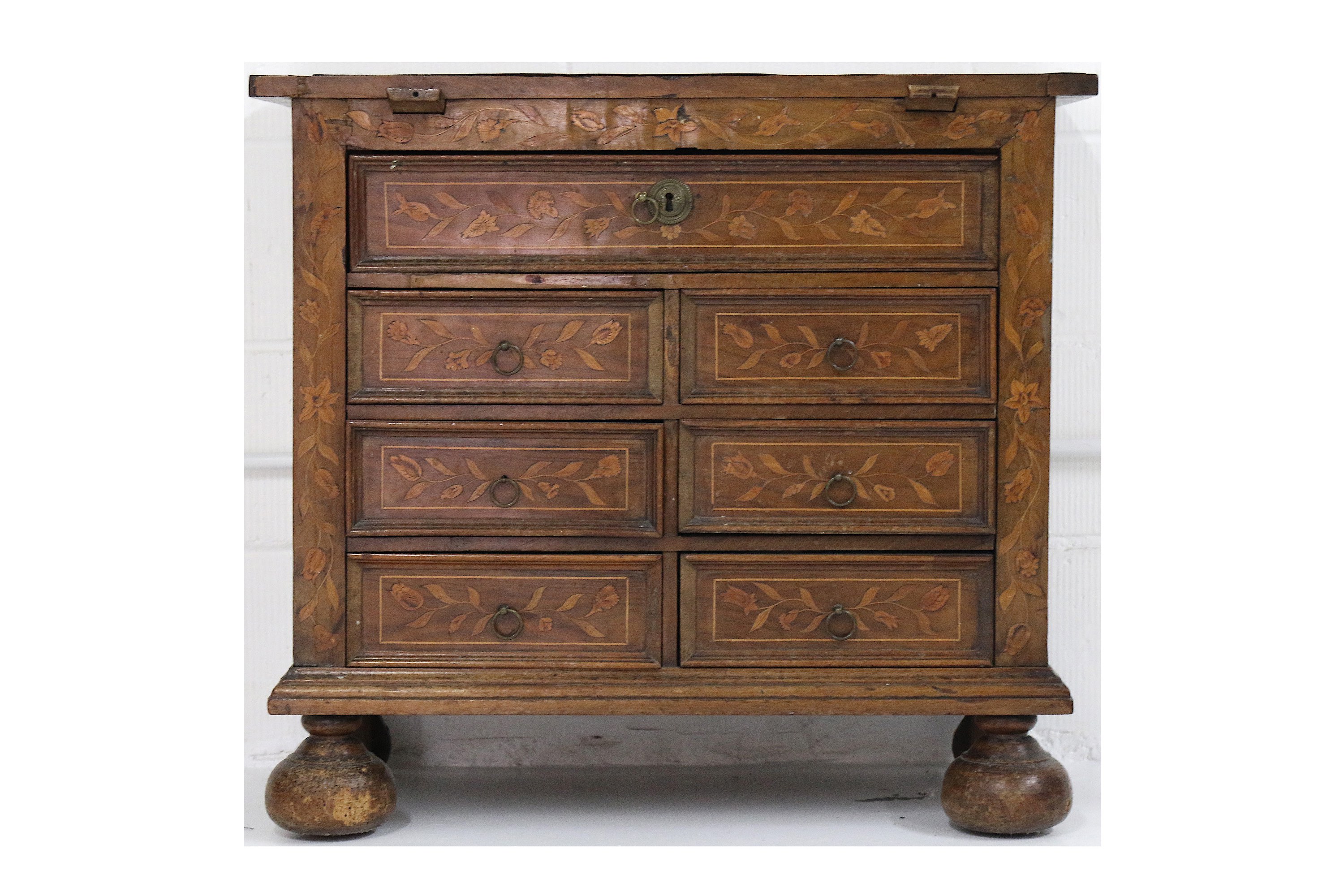 A small 18th Century Dutch walnut and floral marquetry inlaid chest, formerly a Bachelors chest, the