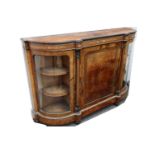 A Victorian burr walnut and inlaid gilt metal mounted credenza, the central panelled door flanked by