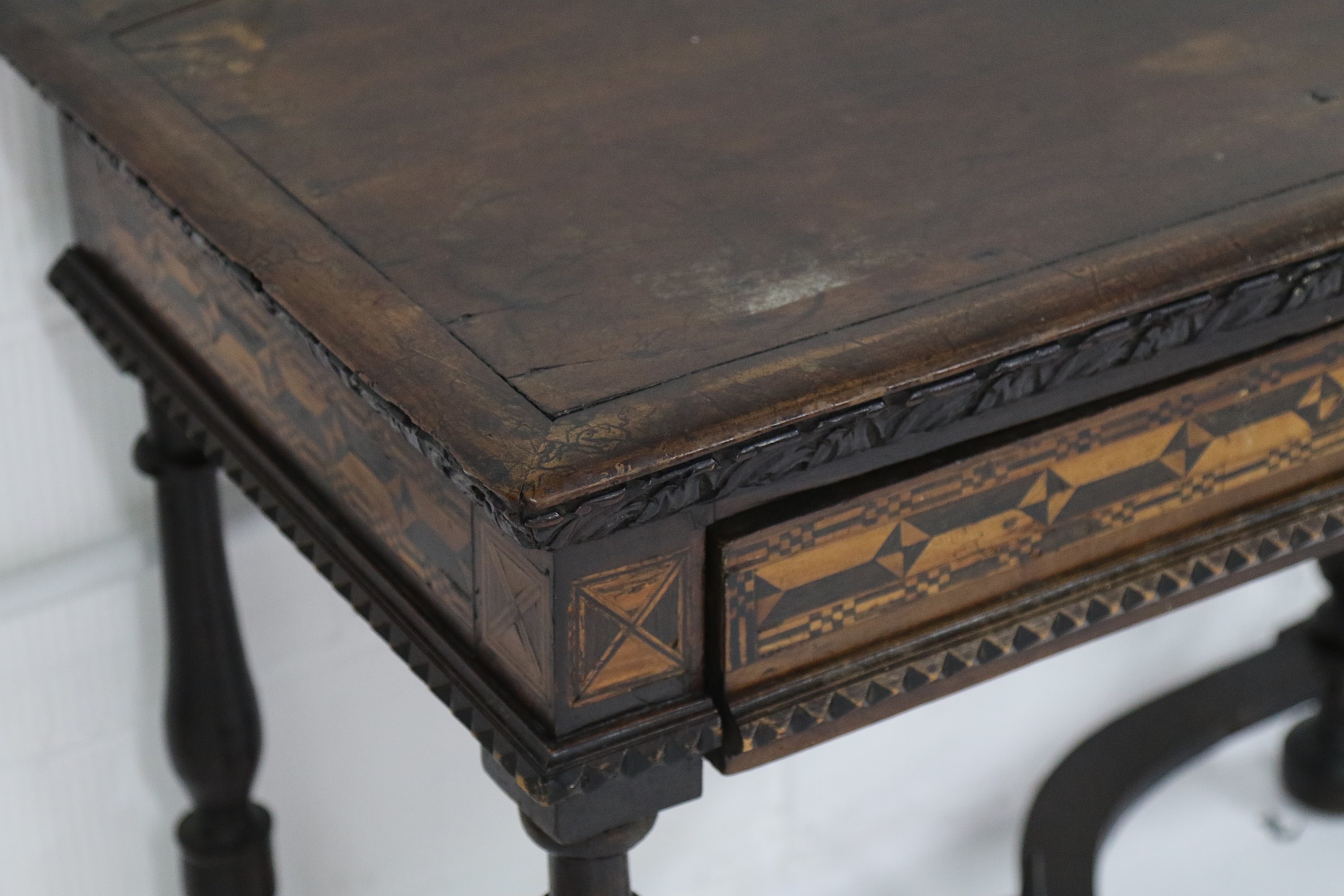 A 17th Century Italian walnut side table, the rectangular top with a carved leaf frieze, over a - Image 2 of 2