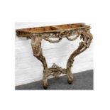 An 18th Century Italian carved wood serpentine console table, with traces of original plate, with