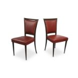 A pair of 1950's Italian dining chairs, in the manner of Paolo Buffa, in mahogany and red skai
