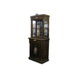 A 19th Century French ebonised and gilt metal mounted display cabinet, the upper section over a
