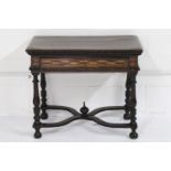 A 17th Century Italian walnut side table, the rectangular top with a carved leaf frieze, over a
